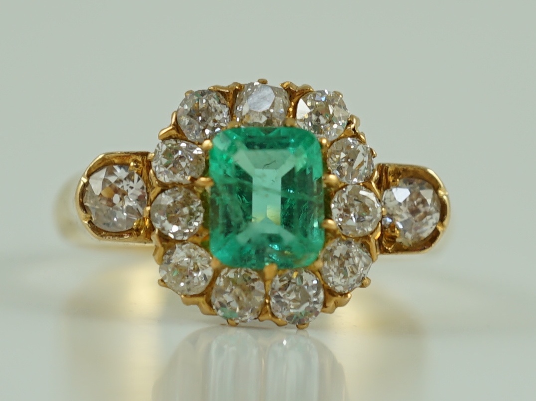 An 18ct gold, emerald and diamond octagonal cluster ring